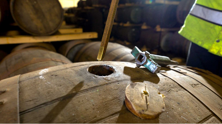 cask of whisky being serviced